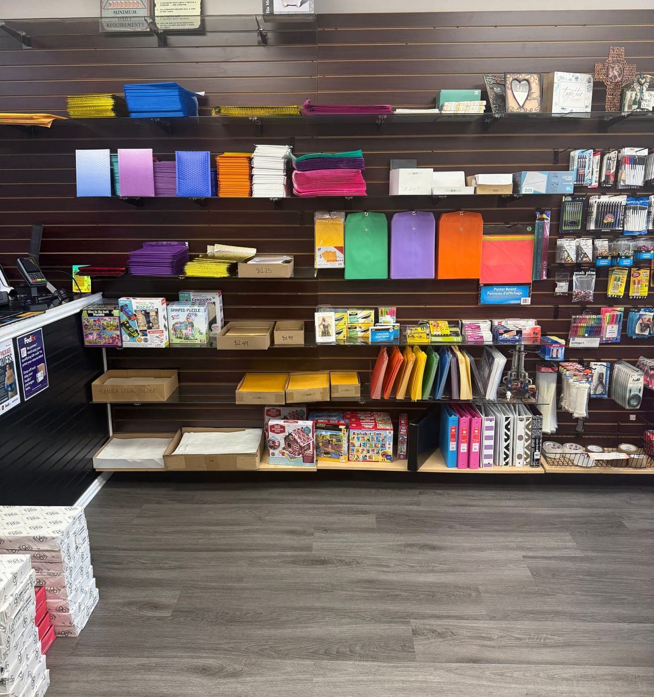 Shelves of colored paper, card stock, envelopes and mailers